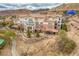 A beautiful condominium complex with desert landscaping and stone walls at 64 Strada Principale # 307, Henderson, NV 89011