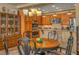 Dining area includes an elegant table with wooden chairs, plus views into the kitchen, offering seamless flow at 64 Strada Principale # 307, Henderson, NV 89011