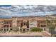 Beautiful multi-story condo building with mountain views and a well-maintained facade at 64 Strada Principale # 307, Henderson, NV 89011