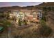 Beautiful exterior of a multi-story condo featuring balconies and tile roof with stone foundation at 64 Strada Principale # 307, Henderson, NV 89011