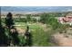 Scenic view of a lush golf course with beautiful homes and mountains in the background on a sunny day at 64 Strada Principale # 307, Henderson, NV 89011