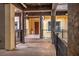 Elegant hallway with decorative columns, lighting fixtures, and refined architectural details at 64 Strada Principale # 307, Henderson, NV 89011