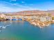 Stunning lake view showcasing waterside residences with bridge access, and serene water at 64 Strada Principale # 307, Henderson, NV 89011