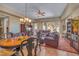 Cozy living room with comfortable seating, warm lighting, and an adjacent dining area at 64 Strada Principale # 307, Henderson, NV 89011