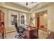 A home office offers a dark wood desk and neutral walls, creating a professional workspace at 64 Strada Principale # 307, Henderson, NV 89011