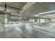 Spacious, well-maintained parking garage with clearly marked parking spots and bright lighting at 64 Strada Principale # 307, Henderson, NV 89011