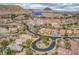 An elevated view of the neighborhood homes, streets and desert landscaping at 64 Strada Principale # 307, Henderson, NV 89011