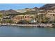 Inviting waterfront view featuring buildings, docks, and beautiful mountain views in the background at 64 Strada Principale # 307, Henderson, NV 89011