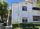 Two-story condo with private stairway and manicured front lawn at 6480 Annie Oakley Dr # 614, Las Vegas, NV 89120