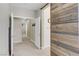 Hallway with view of the sliding barn door that leads into the main bedroom at 6814 Willowcroft St # I, Las Vegas, NV 89149