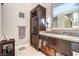 Elegant bathroom with granite countertops, storage cabinets and a large mirror at 7131 Mission Hills Dr, Las Vegas, NV 89113