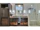 Modern bathroom with vanity, sink, mirror, cabinets and glass shower at 7131 Mission Hills Dr, Las Vegas, NV 89113