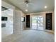 Bright bedroom with walkout, ceiling fan, and custom built-ins, seamlessly blending comfort and style at 7131 Mission Hills Dr, Las Vegas, NV 89113