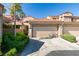 Charming townhome featuring a two-car garage, and a beautiful red tile roof at 7131 Mission Hills Dr, Las Vegas, NV 89113