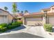 Charming townhome featuring a two-car garage, and a beautiful red tile roof at 7131 Mission Hills Dr, Las Vegas, NV 89113
