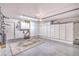 Spacious garage featuring ample storage cabinets and a clean epoxy floor, perfect for organization at 7131 Mission Hills Dr, Las Vegas, NV 89113