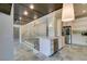 Modern kitchen with stainless steel appliances, bar top seating, and stylish pendant lighting at 7131 Mission Hills Dr, Las Vegas, NV 89113