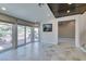 Bright open living room that provides access to the outdoor area with tile flooring at 7131 Mission Hills Dr, Las Vegas, NV 89113