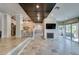 Spacious living room with unique flooring, fireplace, and easy access to the kitchen at 7131 Mission Hills Dr, Las Vegas, NV 89113