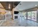 Bright living room boasting sliding glass doors, fireplace, and stylish ceiling at 7131 Mission Hills Dr, Las Vegas, NV 89113