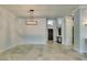 Bright living room features light-colored tiled floors and access to the patio at 7131 Mission Hills Dr, Las Vegas, NV 89113
