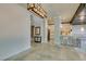 Bright, open-concept living space features tile flooring and access to the kitchen area at 7131 Mission Hills Dr, Las Vegas, NV 89113