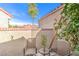 Charming patio area with seating for outdoor enjoyment and potted plants at 7131 Mission Hills Dr, Las Vegas, NV 89113