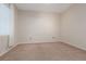 Empty carpeted room with window and vertical blinds ready for staging or decorating at 7163 S Durango Dr # 108, Las Vegas, NV 89113