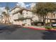 Building exterior showcasing attached garages, covered parking, and fire lane at 7163 S Durango Dr # 108, Las Vegas, NV 89113