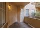 Apartment entry featuring an exterior light fixture, and a cozy alcove at 7163 S Durango Dr # 108, Las Vegas, NV 89113