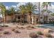 Beautiful building exterior surrounded by well-manicured landscaping and mature palm trees, giving a tropical and inviting feel at 7163 S Durango Dr # 108, Las Vegas, NV 89113
