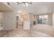 Open floor plan integrating kitchen, living room with fireplace and balcony access at 7163 S Durango Dr # 108, Las Vegas, NV 89113