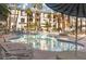 Relaxing pool area surrounded by lounge chairs and umbrellas, offering a perfect oasis for leisure and enjoyment at 7163 S Durango Dr # 108, Las Vegas, NV 89113
