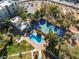 Aerial view of community pool, tennis court and landscaping, perfect for active living and relaxation at 725 N Royal Crest Cir # 237, Las Vegas, NV 89169