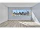 Bedroom with wood floors and large window offering city views at 725 N Royal Crest Cir # 237, Las Vegas, NV 89169