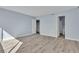 Bedroom with wood floors leading to ensuite bathroom and closet at 725 N Royal Crest Cir # 237, Las Vegas, NV 89169