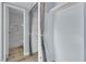 Walk-in closet with curtains, built-in shelving, and access to the bathroom at 725 N Royal Crest Cir # 237, Las Vegas, NV 89169