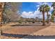 Community common area with manicured landscape, walking paths, and mature trees at 725 N Royal Crest Cir # 237, Las Vegas, NV 89169