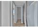Hallway leading to the bathroom with a closet and wood-style flooring at 725 N Royal Crest Cir # 237, Las Vegas, NV 89169