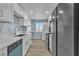 Updated kitchen featuring white cabinets, stainless steel appliances, and views from the window at 725 N Royal Crest Cir # 237, Las Vegas, NV 89169