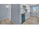 Bright kitchen featuring white cabinets, stainless steel appliances, and light wood flooring at 725 N Royal Crest Cir # 237, Las Vegas, NV 89169