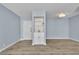 Bright living room featuring wood flooring, modern light-blue paint, and a built-in wet bar at 725 N Royal Crest Cir # 237, Las Vegas, NV 89169