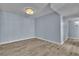 Bright living room featuring wood flooring and modern light-blue paint at 725 N Royal Crest Cir # 237, Las Vegas, NV 89169