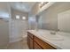 Bathroom featuring a double vanity, ample counter space and shower over tub at 8348 Mokena Ave, Las Vegas, NV 89178