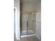 Bathroom featuring a tiled glass enclosed shower and neutral paint at 8348 Mokena Ave, Las Vegas, NV 89178