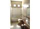 Bright bathroom featuring a tub-shower combination with white tile surround and double sink vanity at 8348 Mokena Ave, Las Vegas, NV 89178