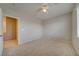 Bright, carpeted bedroom with a window and a view into another room, inviting comfort at 8348 Mokena Ave, Las Vegas, NV 89178