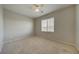 Bright bedroom features neutral walls, a ceiling fan, and a window providing ample natural light at 8348 Mokena Ave, Las Vegas, NV 89178