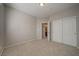 Carpeted bedroom features closet and a view into the bathroom at 8348 Mokena Ave, Las Vegas, NV 89178