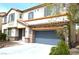 Charming two-story home featuring stone accents, a spacious driveway, and well-maintained landscaping at 8348 Mokena Ave, Las Vegas, NV 89178
